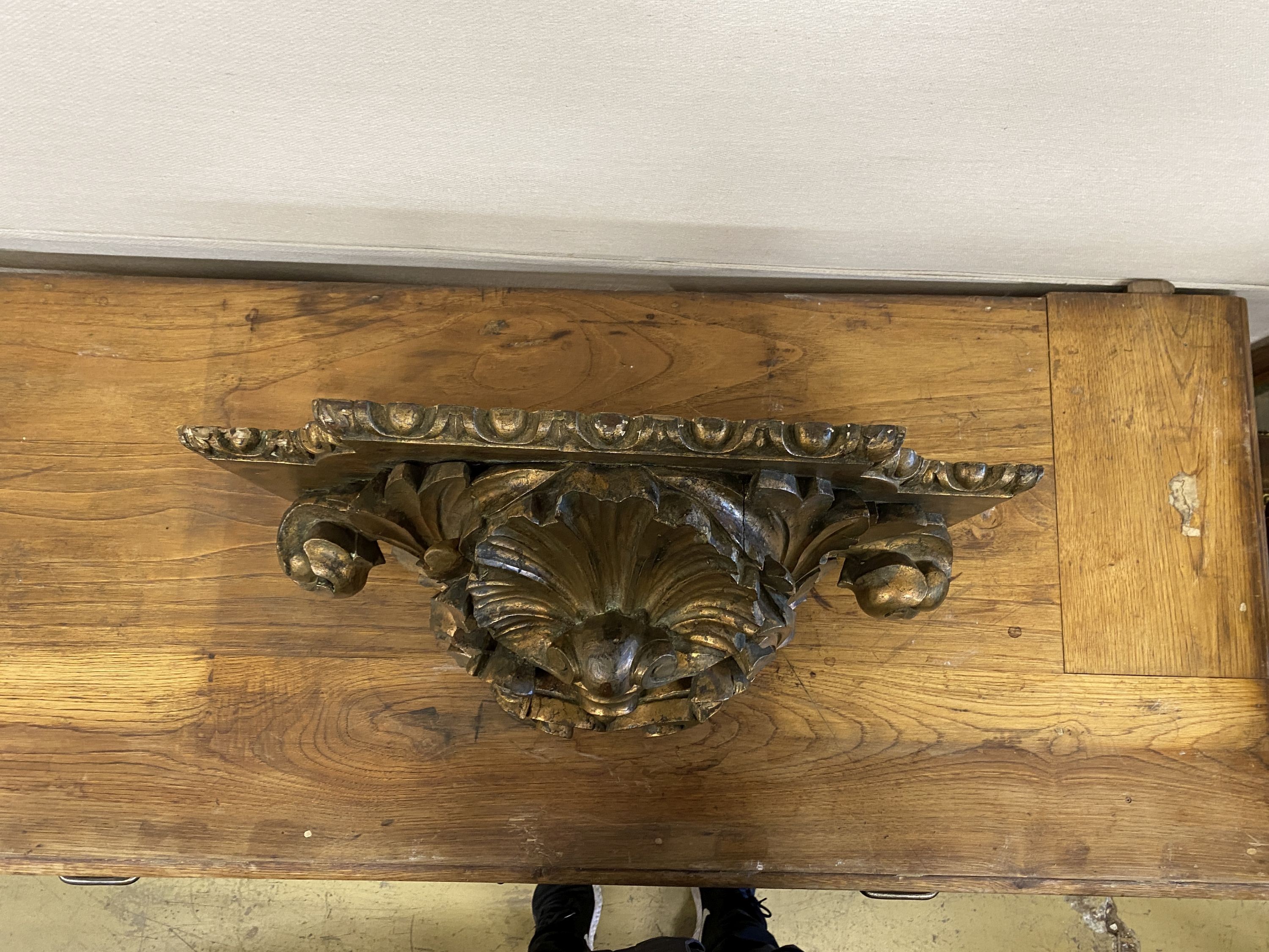 A 19th century carved giltwood wall hanging bracket, width 56cm, depth 33cm